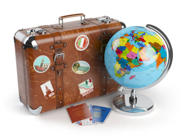 istock Travel tourism. Old suitcase, globe and passports isolated on white 641134616