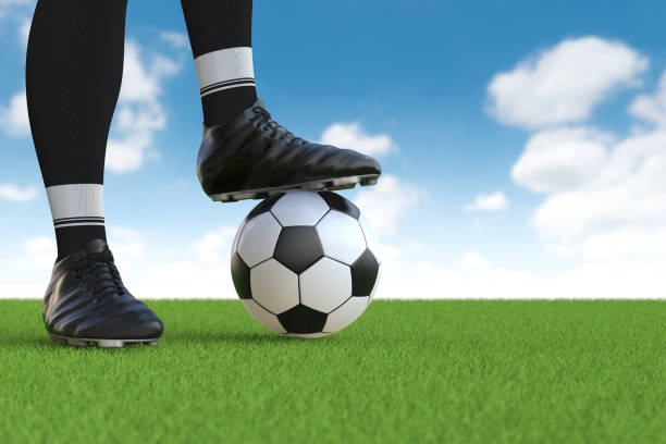istock soccer player standing with soccer ball 641135294