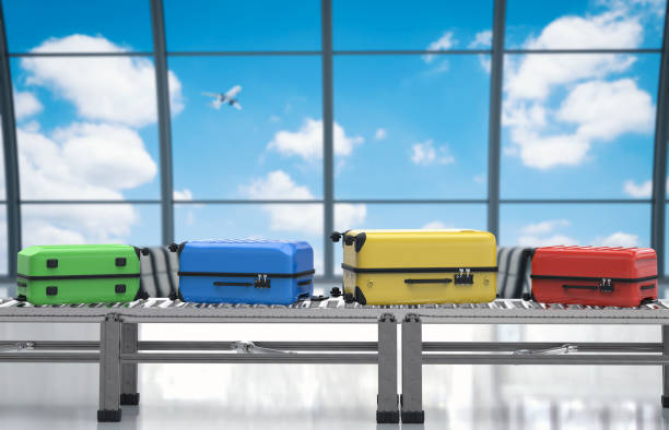 istock colorful luggages on conveyor belt 641139564