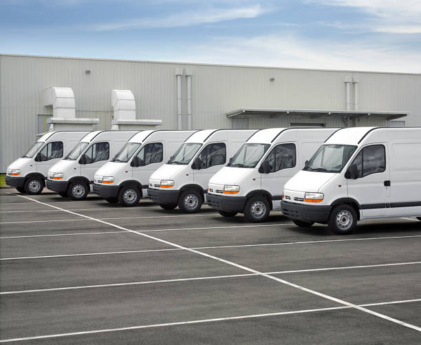 istock Fleet of vans in front of industries 641139740