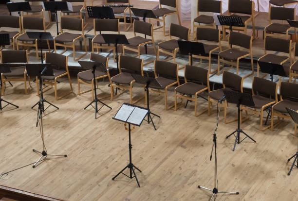 istock Empty stage with chairs, microphones and music stands before the 641139960