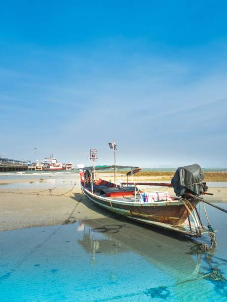 istock Beautiful Thai Boat on Blue Sky Background 641142080