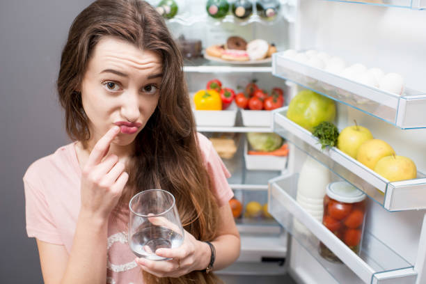 istock Woman near the refrigerator 641147196