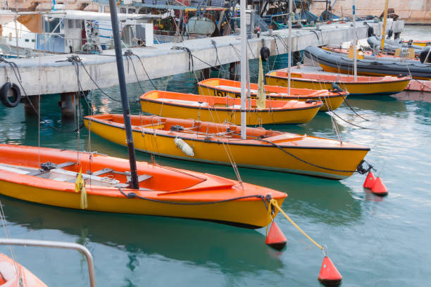 orange sailboats docked in port - old jaffa - israel - sailboat sunset tel aviv sea imagens e fotografias de stock