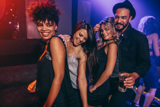 istock Group of friends dancing at disco club 641153174