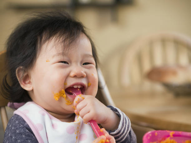 istock eating mess baby girl 641154778