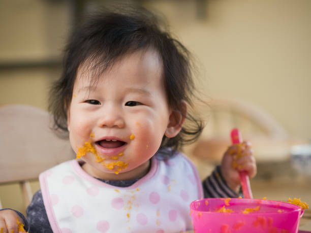 istock eating mess baby girl 641154784