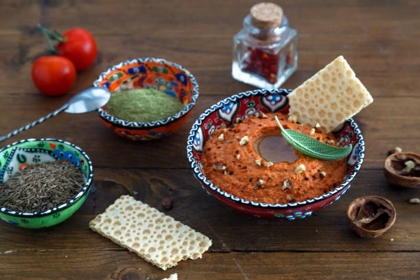 istock Walnuts and pepper dip sauce Muhammara and ingredients close-up on the table. horizontal 641155540