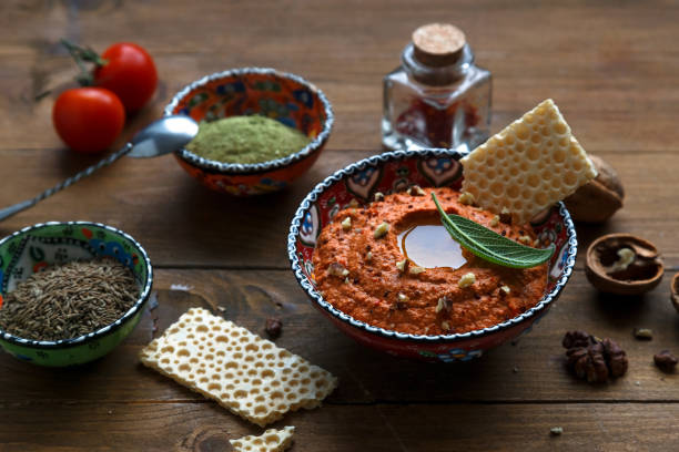 istock Walnuts and pepper dip sauce Muhammara and ingredients close-up on the table. horizontal 641155550