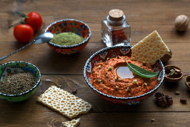 istock Walnuts and pepper dip sauce Muhammara and ingredients close-up on the table. horizontal 641155566