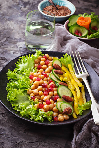 istock Salad with cucumber, pepper, pomegranate chick-pea 641157218