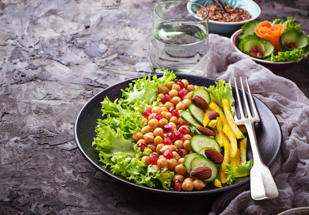 istock Salad with cucumber, pepper, pomegranate chick-pea 641157232