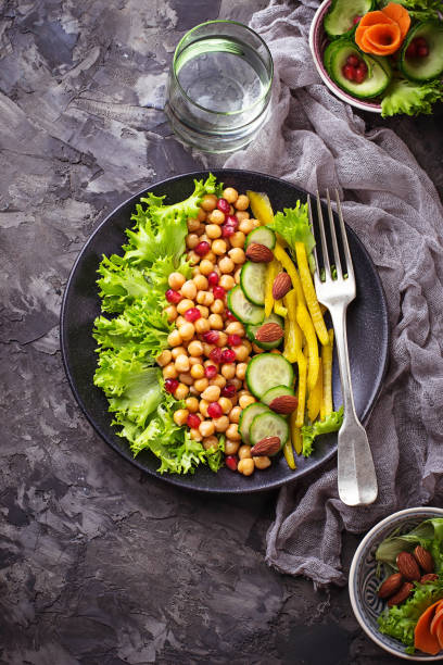 istock Salad with cucumber, pepper, pomegranate chick-pea 641157234