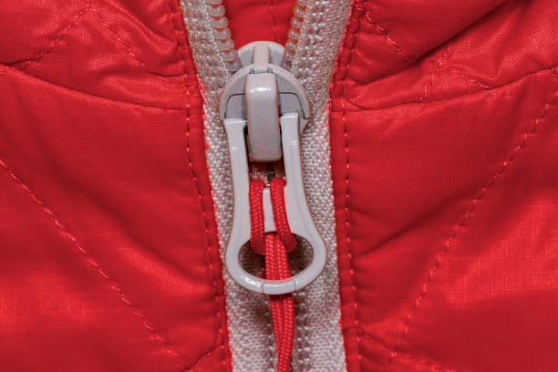 istock Closeup of a zipper on a red winter jacket 641158188