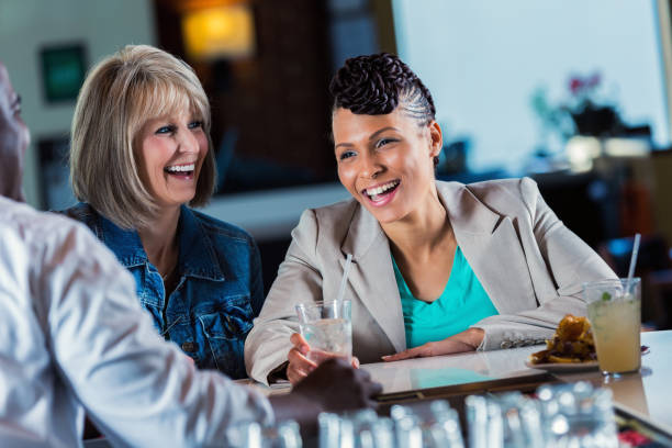 istock Pretty African American woman has drinks with her friend after work 641159842