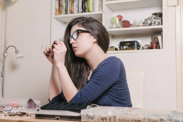 istock Female designer making jewelry 641163178