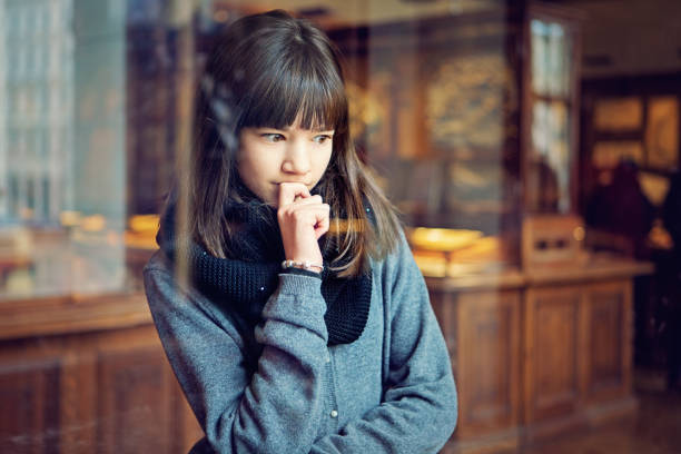 Teenage girl is looking museum exhibition Serious teenage girl is looking museum exhibition with interest historical museum stock pictures, royalty-free photos & images