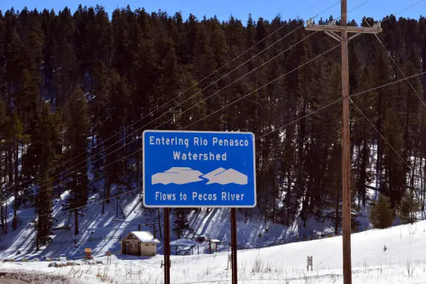 Penasco watershed sign in New Mexico during a snowy winter