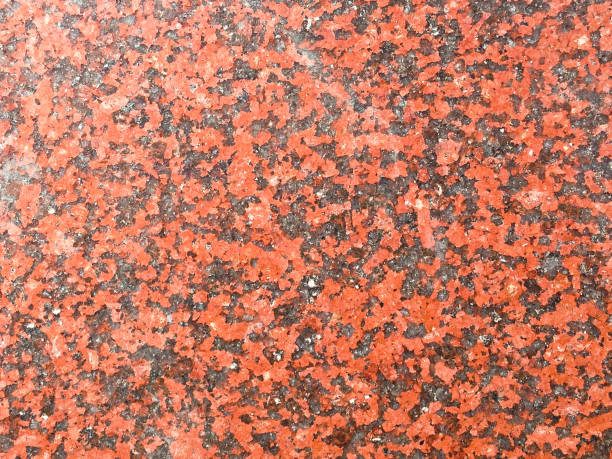 istock Closeup of red granite abstract texture background 641168262