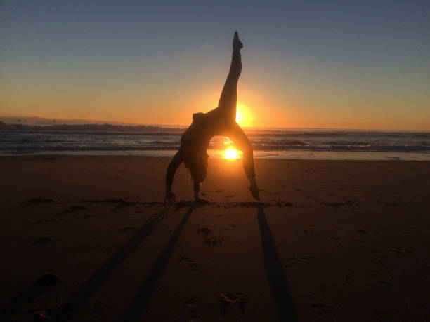 istock Happiness in Nature gymnastics on the beach 641170526
