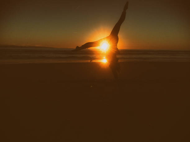 istock kicking the sun on a beach 641170532