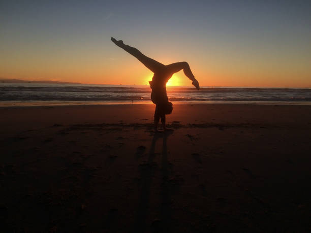 istock Happiness in Nature gymnastics on the beach 641170538