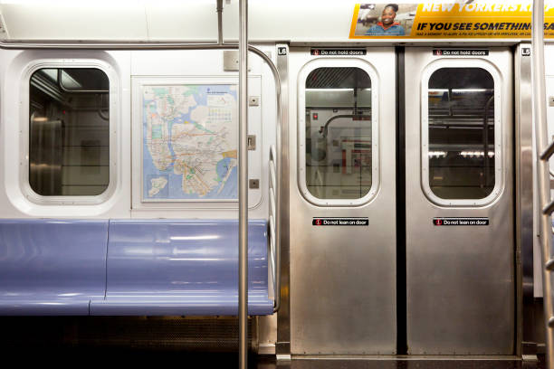 New York, NY, USA - September 6, 2016: Inside of New York Subway: Seats and inside of empty car: The NYC Subway is one of the oldest and most extensive public transportation systems in the world.