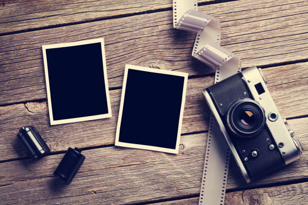 istock Vintage camera and blank photo frames 641174654