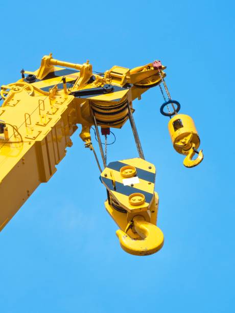 istock Close up : Yellow Crane on Bright Blue Sky Background 641175242