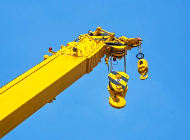 istock Close up : Yellow Crane on Bright Blue Sky Background 641175276