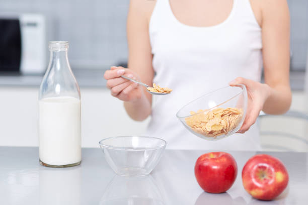 istock Female cooking breakfast at modern kitchen 641175566
