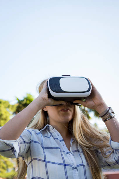 istock Woman trying virtual reality simulator glasses 641177286