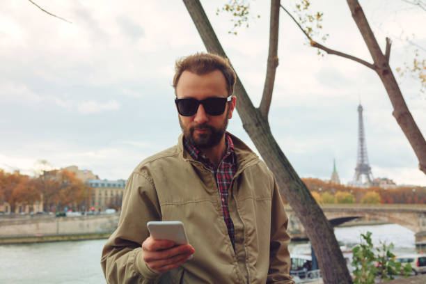 istock Modern guy using smartphone in the European city. 641177768