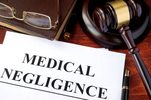 istock Medical Negligence form, documents and gavel on a table. 641184132