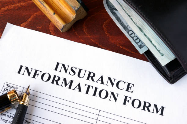 istock Insurance information form  and wallet on a table. 641184586