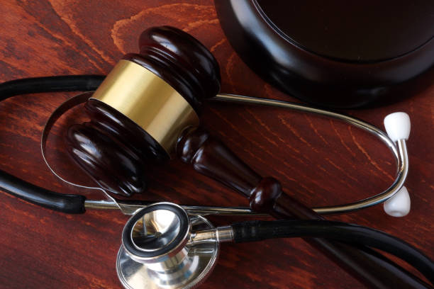istock Gavel and stethoscope on a wooden surface. 641184952