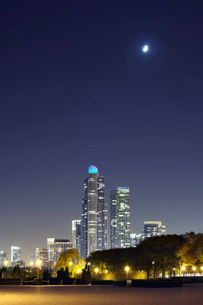 Moon over Chicago downtown at night, USA.
