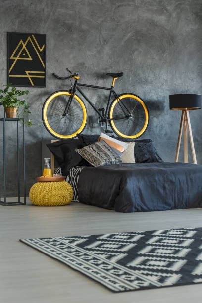 istock Grey student bedroom with bike 641192780