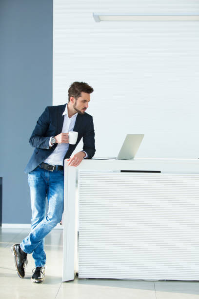 istock Thoughtful young businessman using laptop looking for new ideas. 641193896