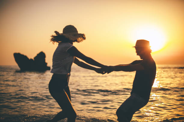 istock Playful couple in the sea 641196504