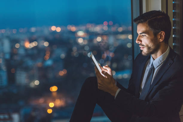 istock Businessman with digital tablet late in the office 641197414