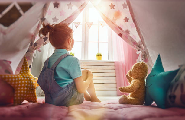 istock girl plays at home 641198558