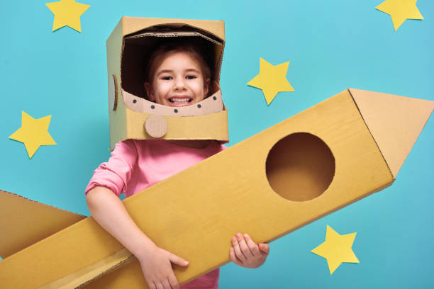 istock girl in an astronaut costume 641199382