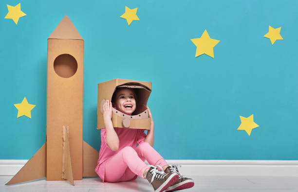 istock girl in an astronaut costume 641199392