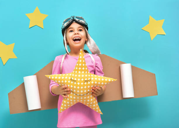 istock girl in an astronaut costume 641199448