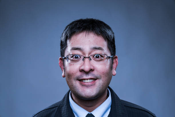 A mid adult man looking very happy or satisfied