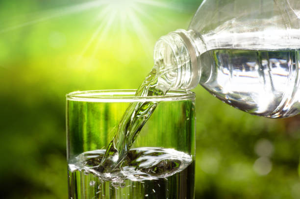 istock Drink water pouring in to glass over sunlight 641203176