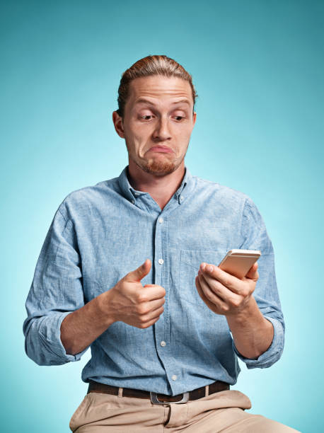 istock The young surprised caucasian man on blue background 641203442