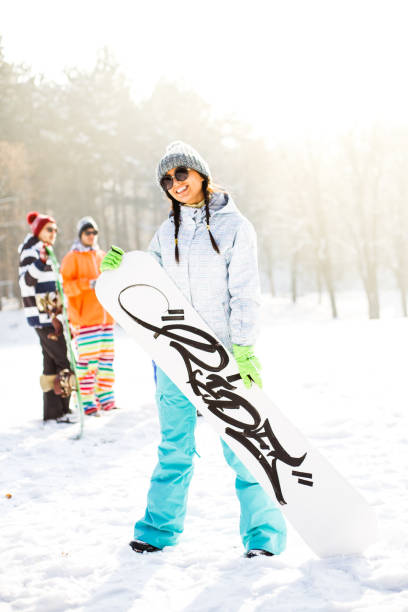 istock Girl with snowboard 641203510