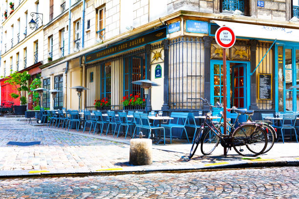 Paris, France, Restaurant Chez Julien, 12 06 2012 - empty tables and chairs on the street in the center of the city stock photo